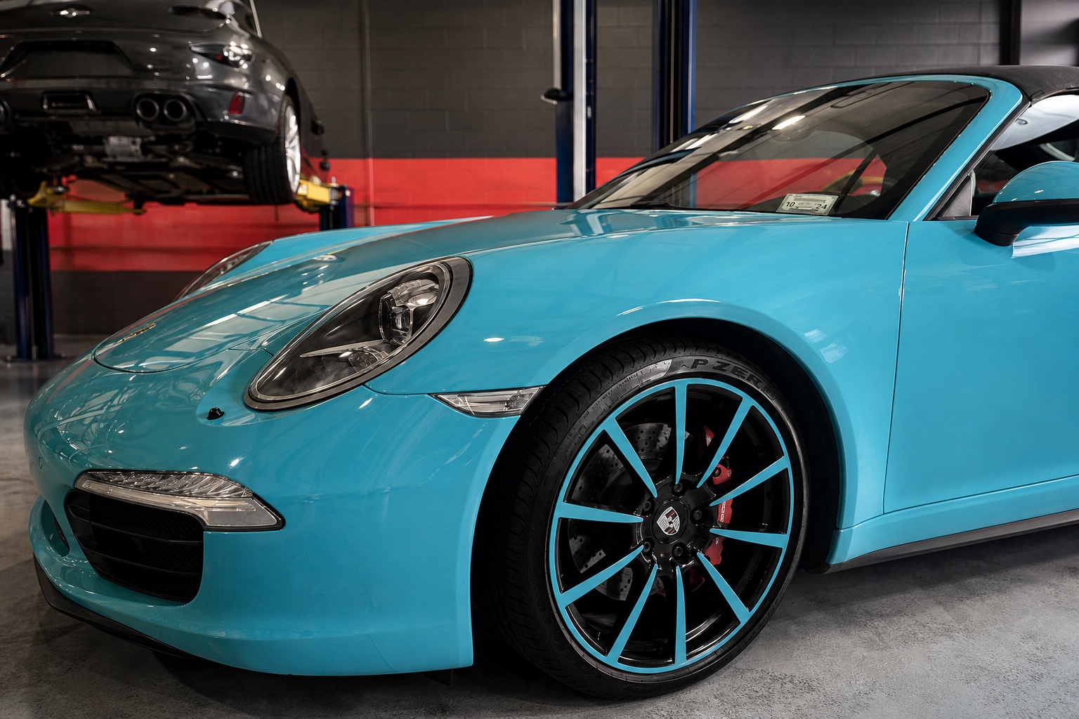 Refinished sports car wheel with a detailed powder-coated finish
